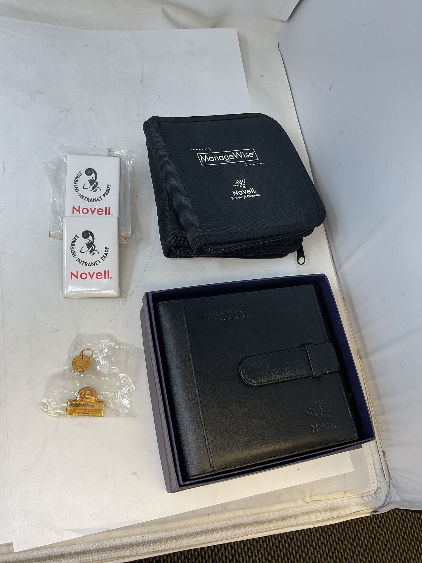 NOVELL NOVELTY MERCH  LIGHT-UP PROMO PINS, CD CASES - PREOWNED