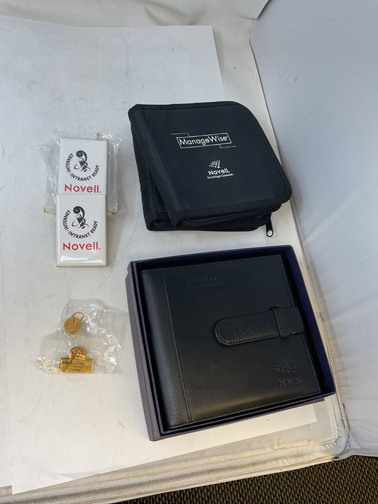 NOVELL NOVELTY MERCH  LIGHT-UP PROMO PINS, CD CASES - PREOWNED